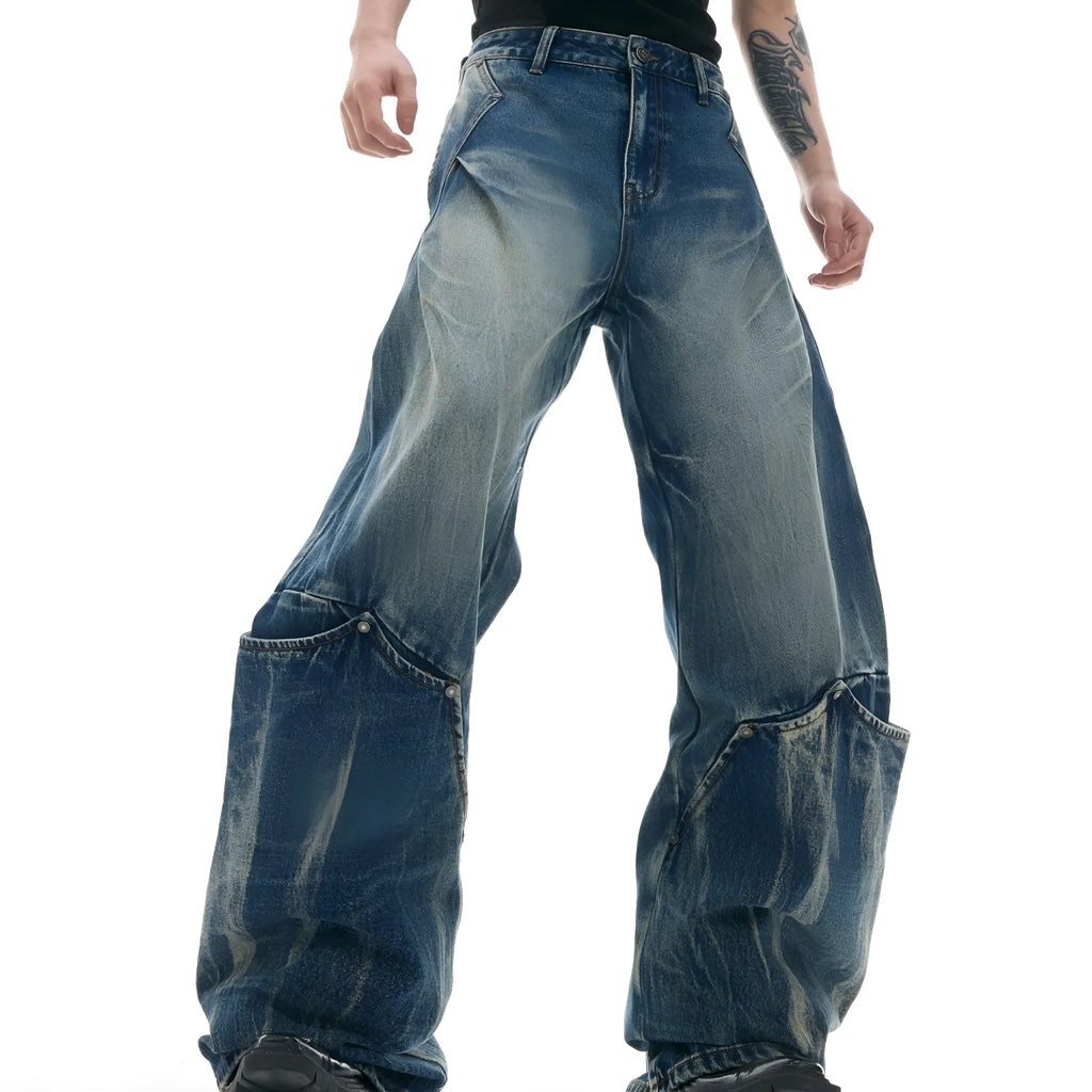 Men's verdant blue jeans with retro washed burst pattern and curved knife silhouette in loose fit