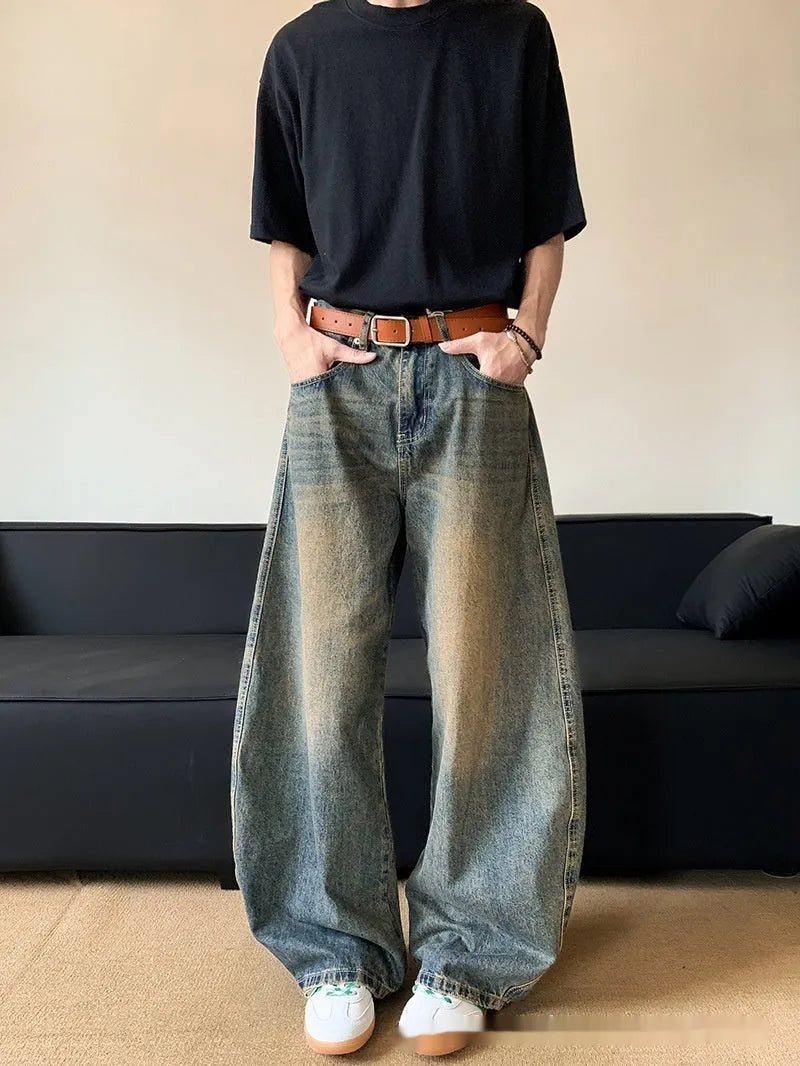 Men's retro blue distressed denim jeans with machete detailing and wide-leg fit