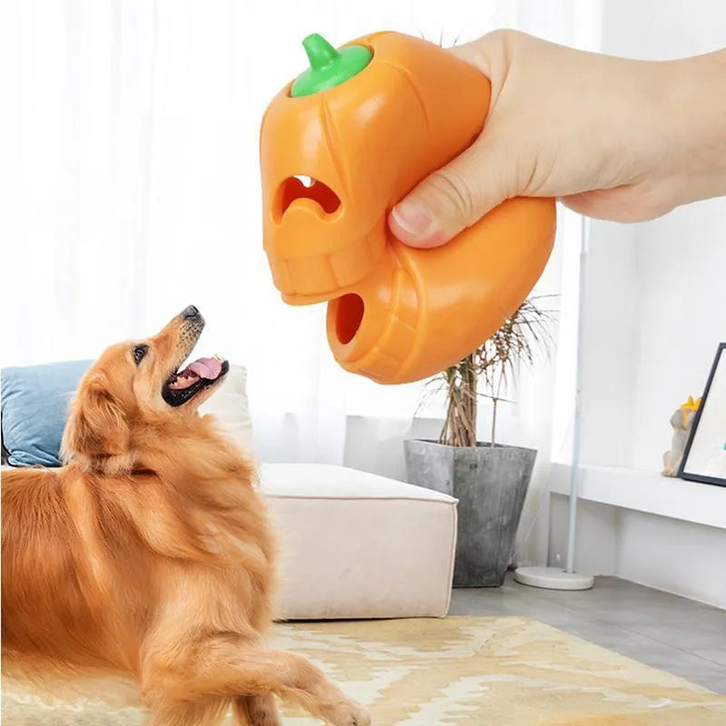 Yellow pumpkin-shaped TPR dog chew toy for aggressive chewers on white background
