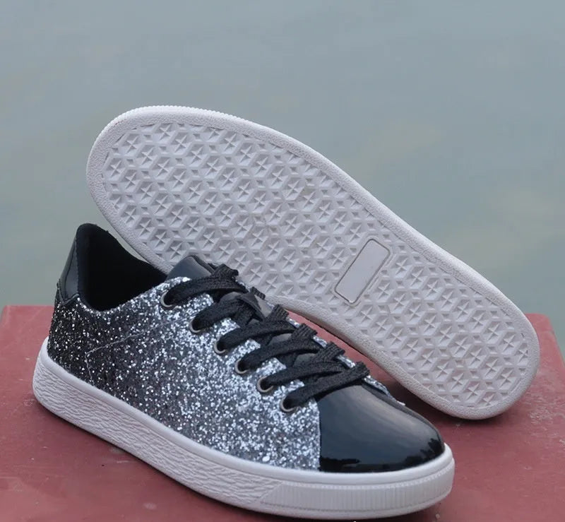 Women's black low-top lace-up shoes with glittering sequins on the upper.