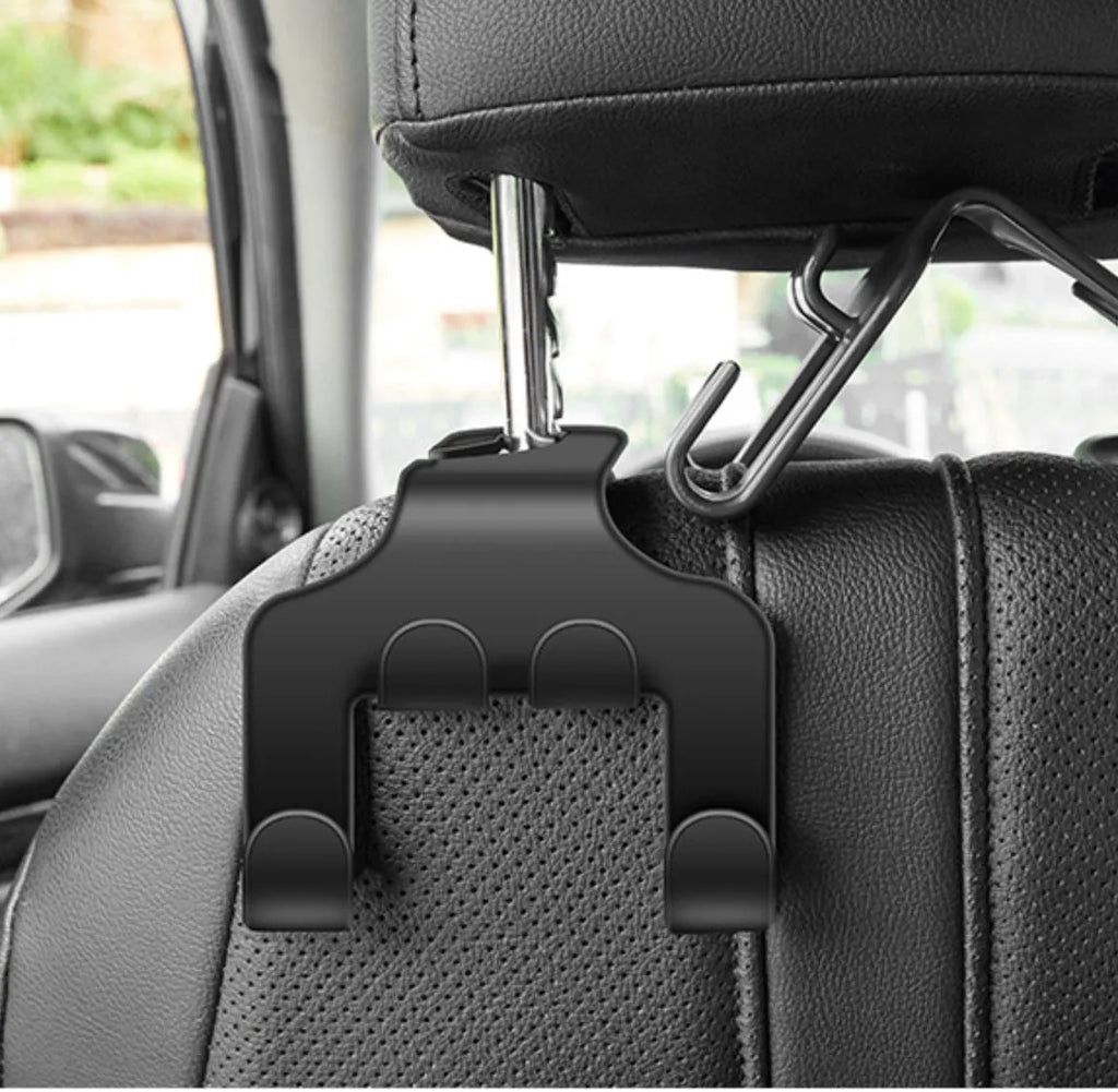 Pack of two black ABS plastic multifunction car hooks for mounting on dashboard or console.