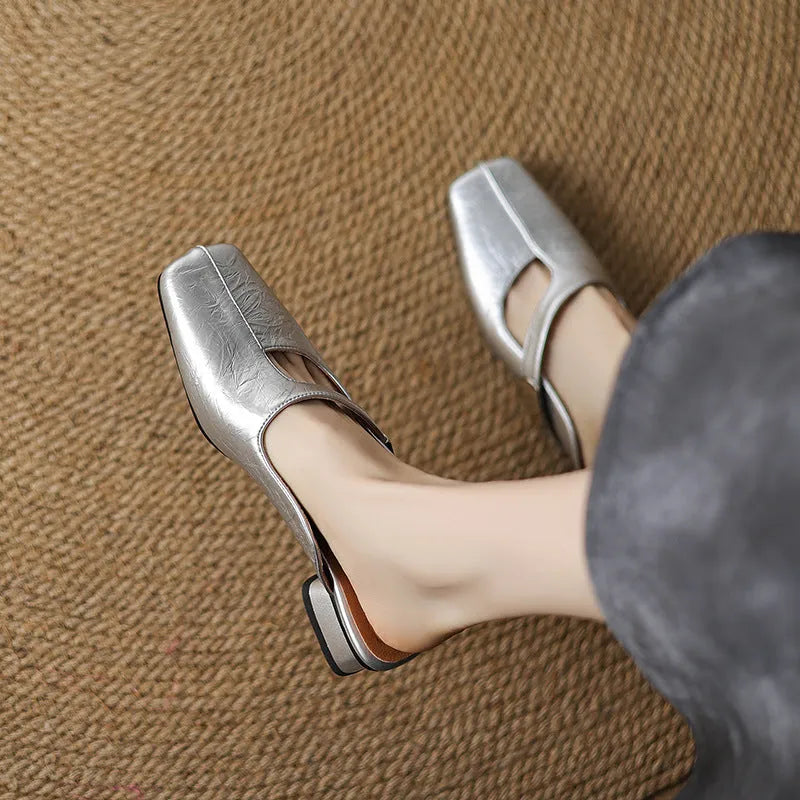 Women's square-toe outdoor slippers in black with a low heel and rubber sole.