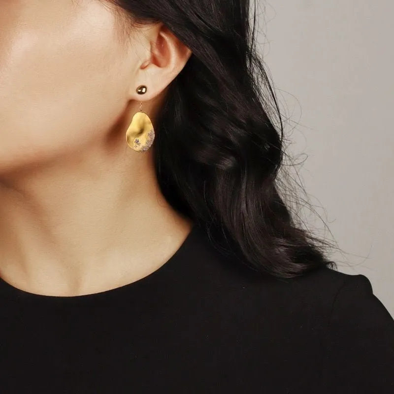 Chinese style asymmetrical floral earrings with zircon detailing in gold or silver finish