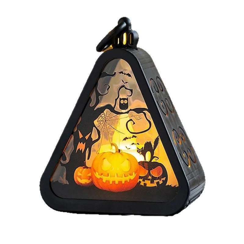 A portable Halloween decoration pumpkin lamp prop in plastic and glass, showing scale against a measuring tape.