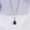Women's drop-shaped pendant necklace with rhinestone geometric pattern in pink electroplated finish