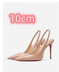 Women's black stiletto heel sandals with an ankle strap buckle and pointed toe on a red background.