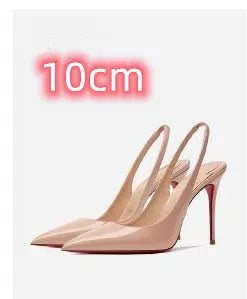 Women's black stiletto heel sandals with an ankle strap buckle and pointed toe on a red background.