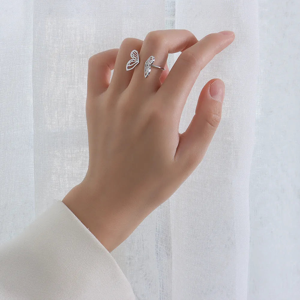 Titanium steel hollow butterfly ring with adjustable opening in gold colour