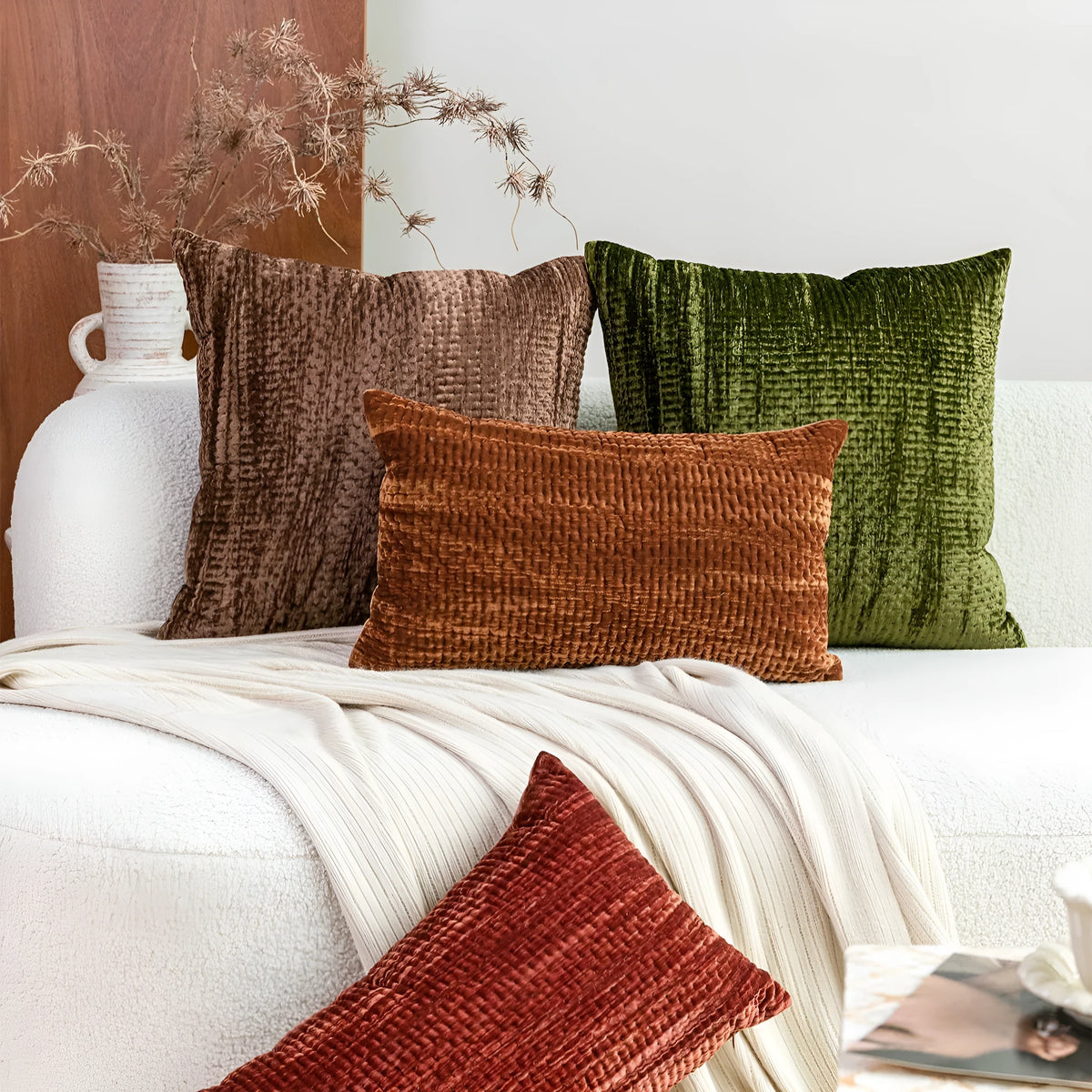 Mercerized velvet embossed cushion pillow in Green, 50x50cm square, on a modern sofa