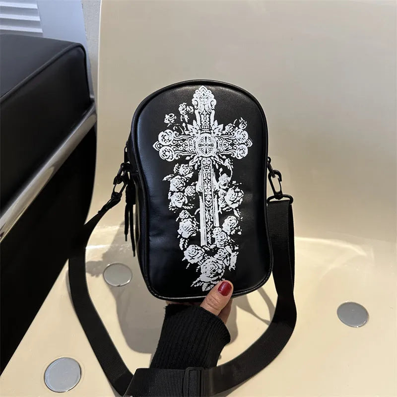 Halloween graffiti print crossbody phone bag with cartoon pumpkins, in multiple colours.