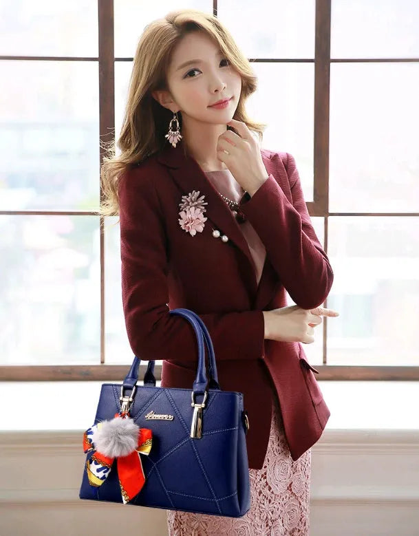 Ladies PU messenger bag with embroidery detail and soft handle in cross-section square shape