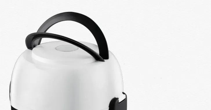 White rice cooker with 2-litre capacity and digital controls on kitchen counter