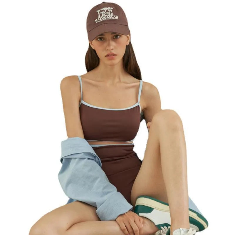 Brown triangle one-piece swimsuit for women on a mannequin.