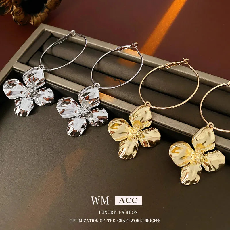 Vintage silver and gold metal flower earrings with geometric shapes and electroplated finish.