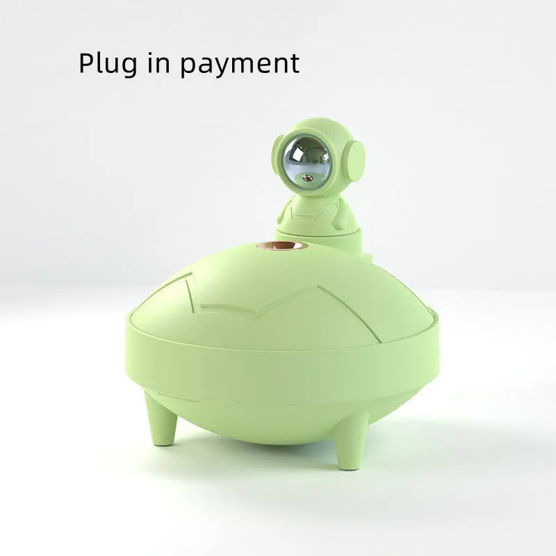 Astronaut sunset lamp humidifier with 360 degree rotating head in green colour, placed on a nightstand