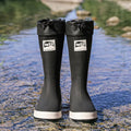 Pair of solid colour high tube PVC rain boots with a low heel on a non-slip sole.