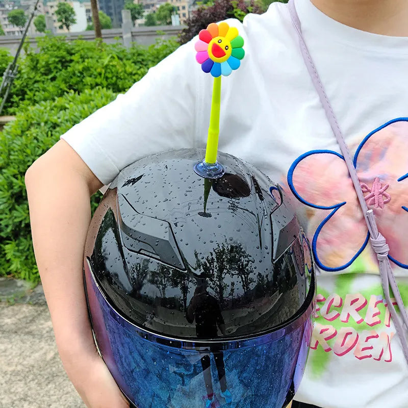 Silicone sunflower helmet decoration with suction cup on a helmet, showing swinging design