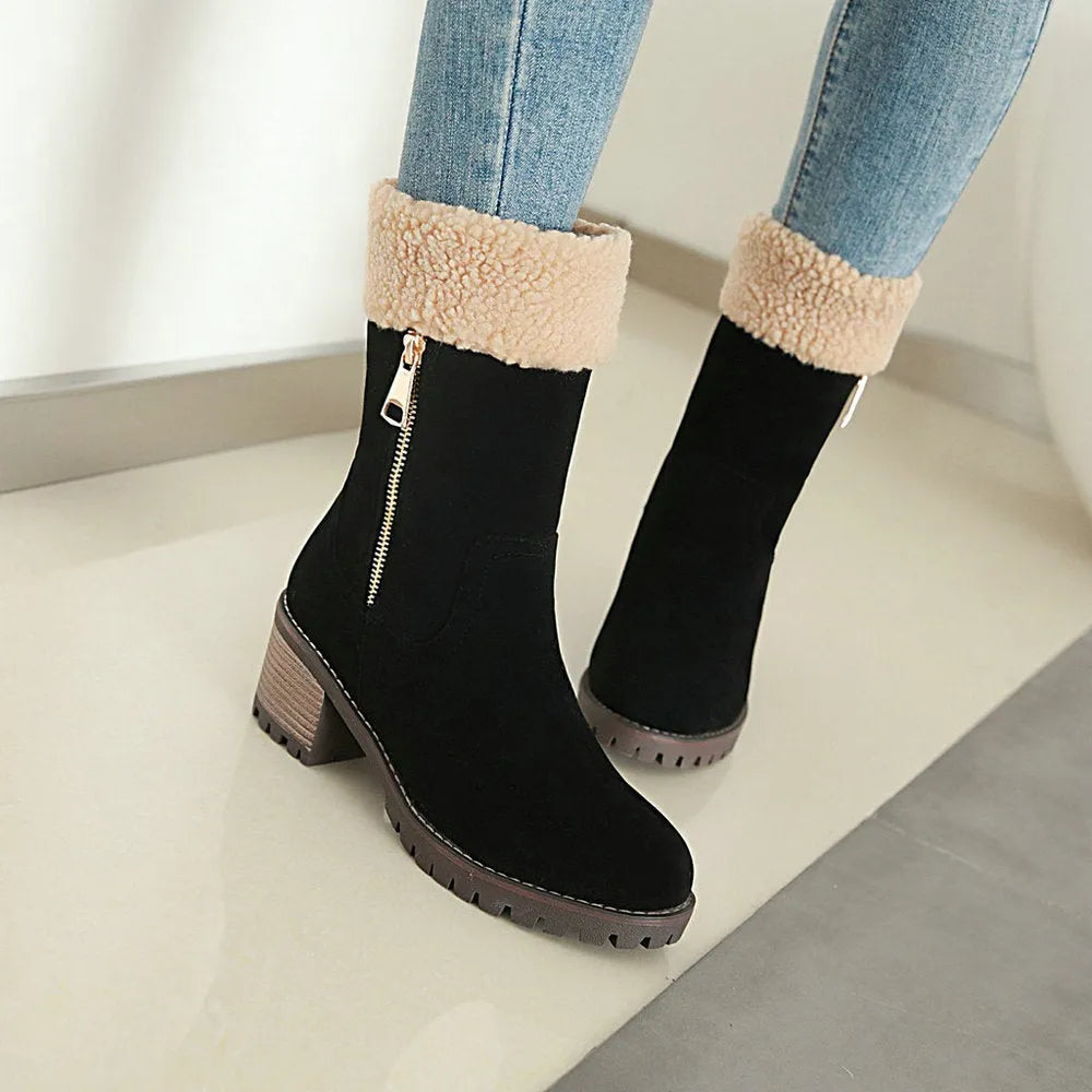 A pair of snow boots in black, grey, green, or orange with a rubber sole and plush lining.