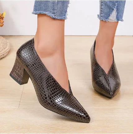 Women's black Martin boots with V-cut pointed toe, embossed artificial PU upper, and chunky heel
