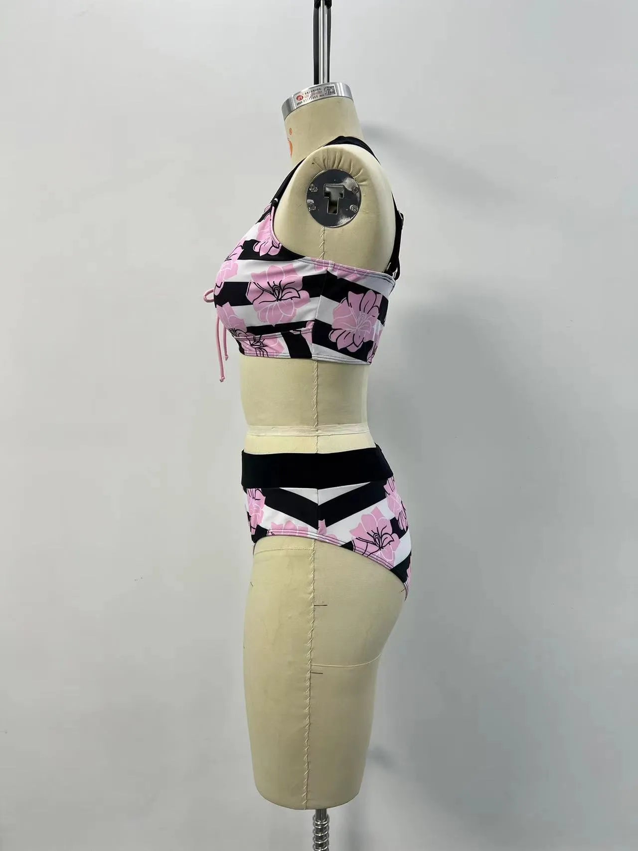 Black women's high-waisted bikini with belly coverage slimming design and split bottom style