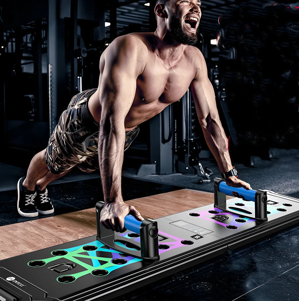Black multifunctional push-up board for chest and abdominal training measuring 87x43x20cm with TPE soft rubber grips and ABS plastic construction