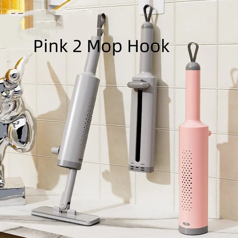 Rotatable self-squeeze mini flat mop with crevice brush and pink microfiber pad, shown extended to 19.3 inches.