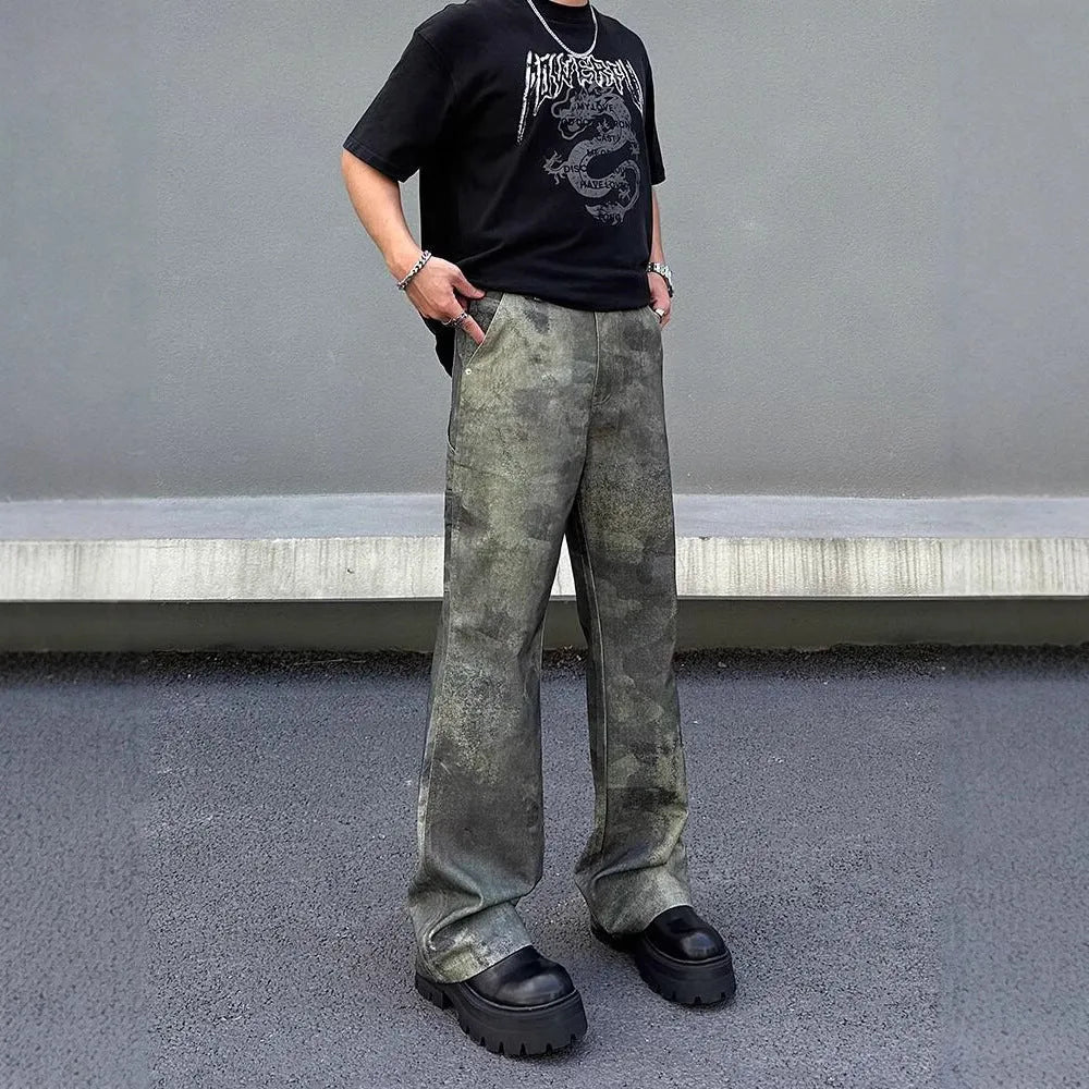 Men's straight leg jeans with a retro digital camouflage print on blue denim fabric.