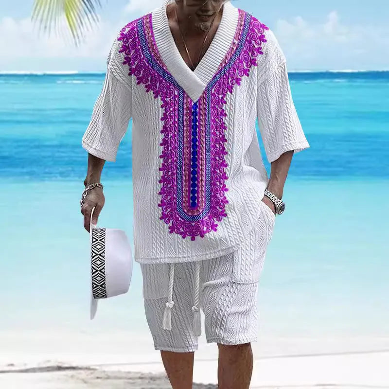 Man wearing a printed drop-shoulder knitted short-sleeve jacket with matching shorts in a casual setting.