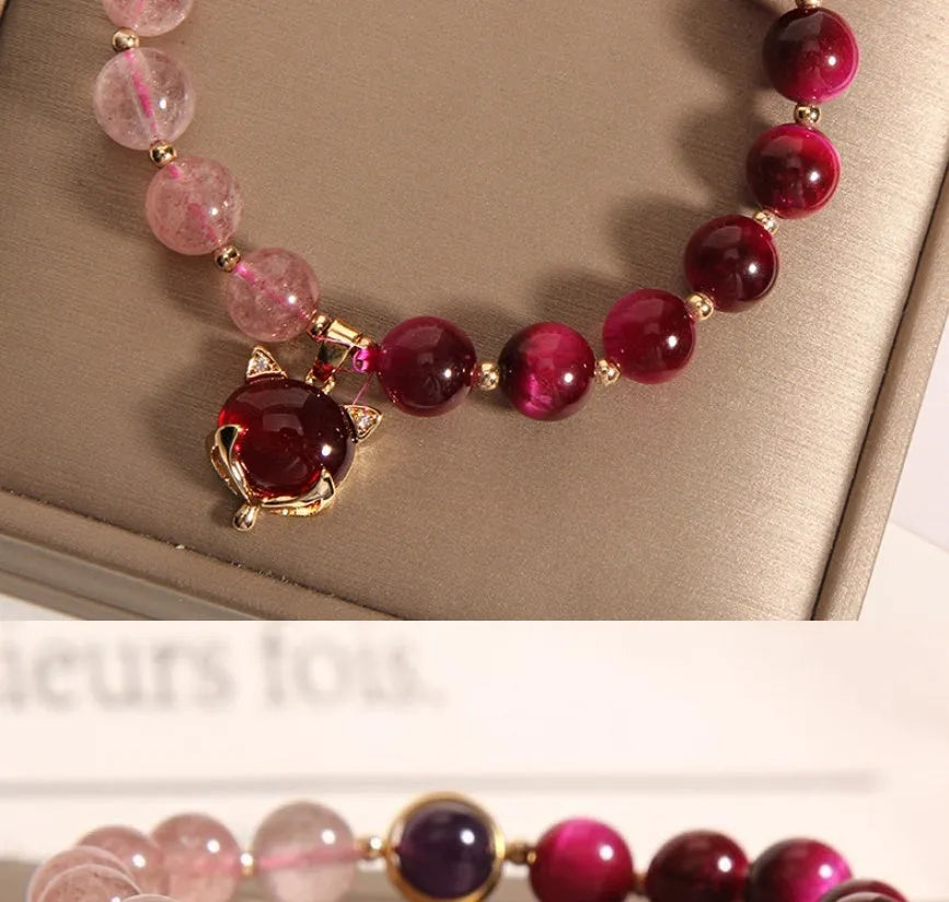 Women's simple strawberry crystal bracelet on an 18cm elastic band.