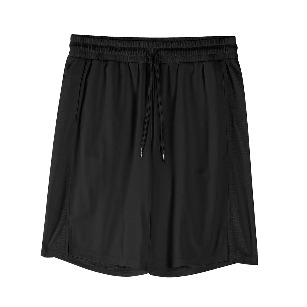 A man wearing loose-fitting black quick-dry mesh fitness shorts with an elastic waist.
