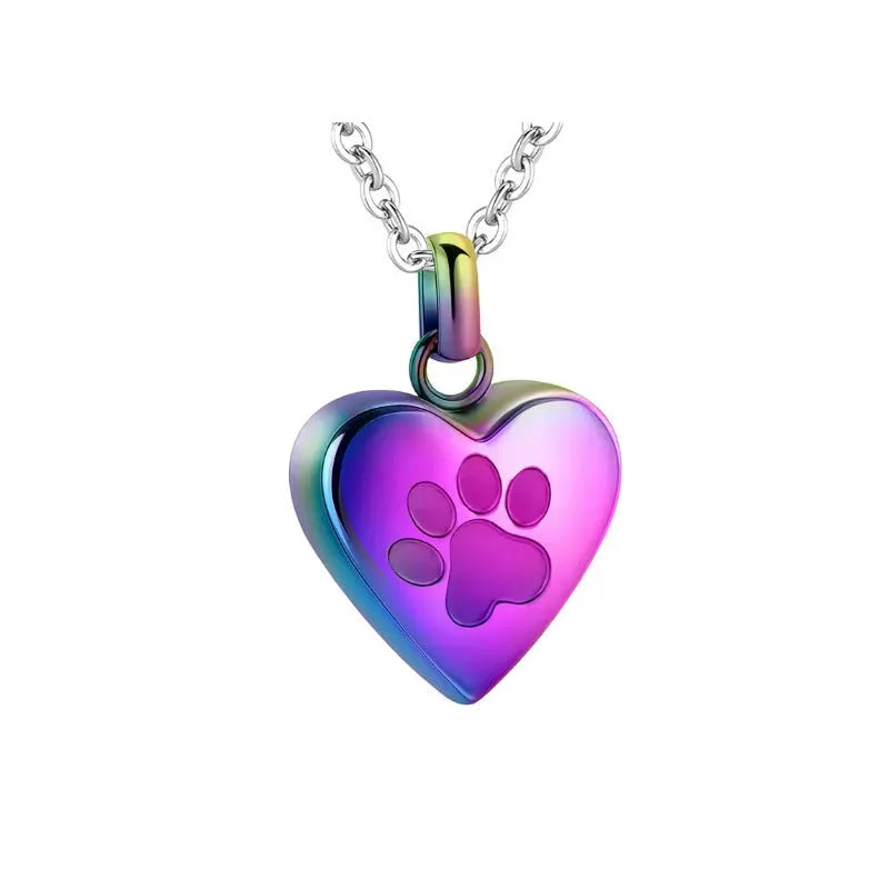 Silver heart pendant necklace with paw print design that opens as a casket.