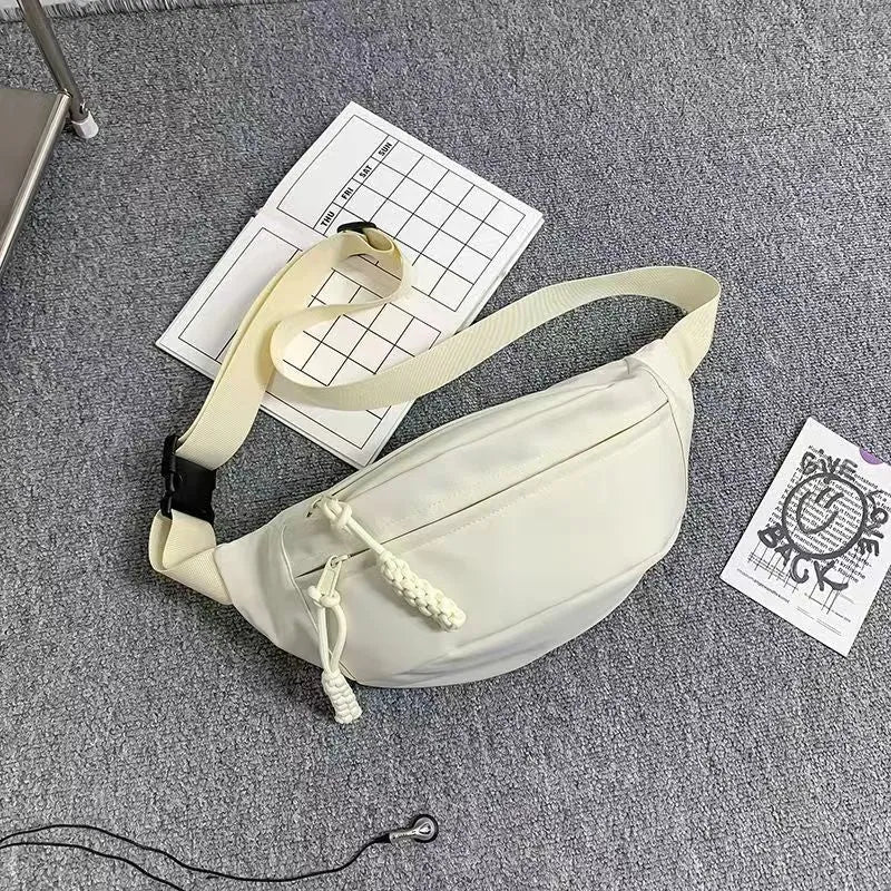 Small men's polyester crossbody chest bag in black with nylon lining and 35cm width
