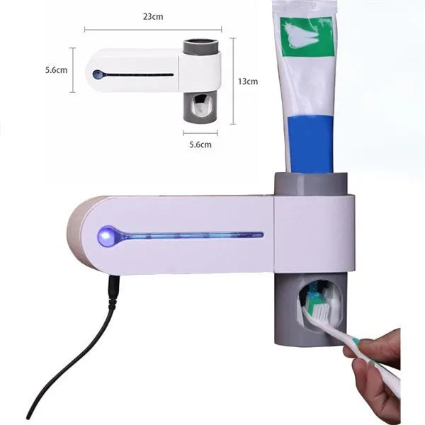 White 3-in-1 toothbrush holder with UV steriliser and toothpaste dispenser, wall-mounted on a bathroom tile