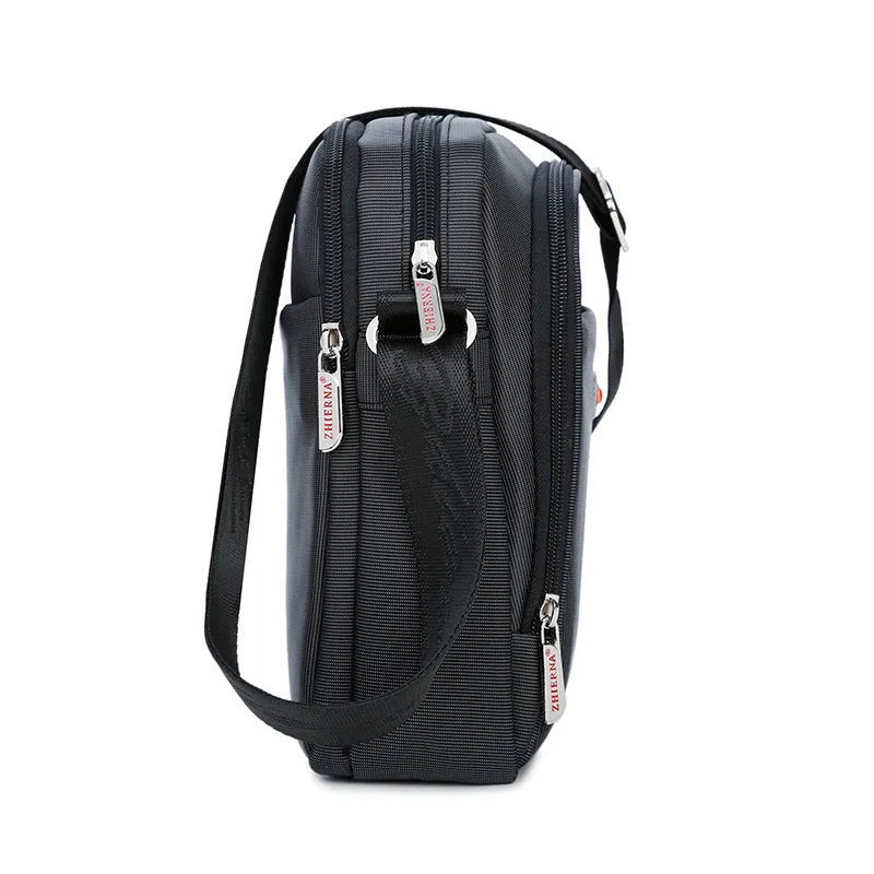 Men's black Oxford cloth messenger bag with zipper closure, single shoulder strap, and printed car-suture outer pocket