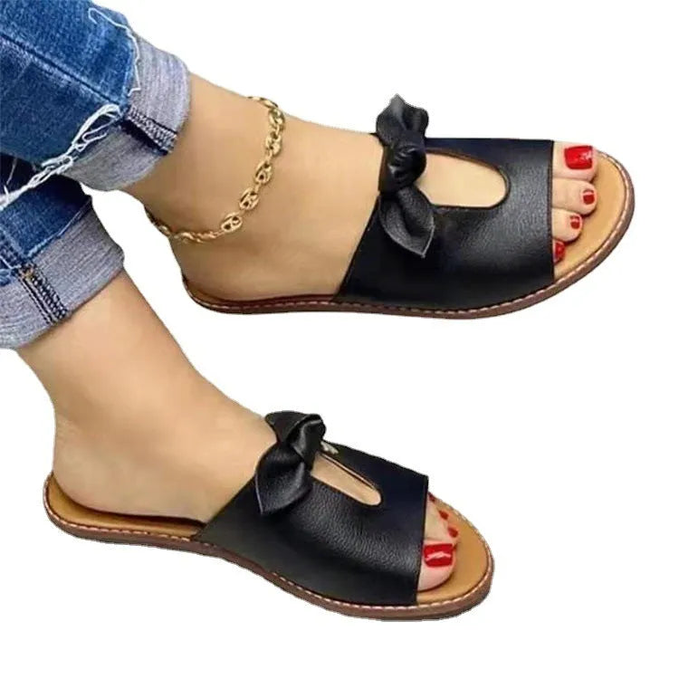 Ladies fish mouth sandals with a bow decoration in black, pink, or gold colours