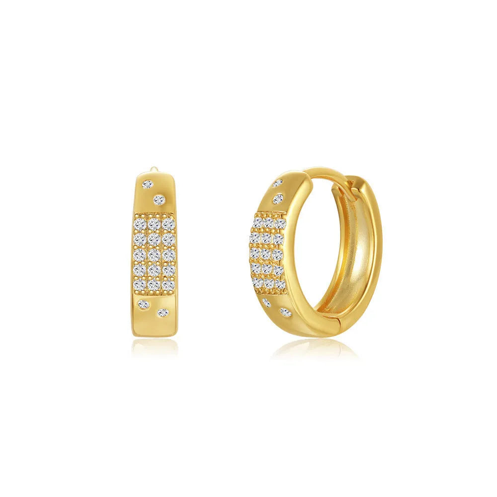 A pair of gold tone geometric earclip earrings with a round design and screw-back mechanism.