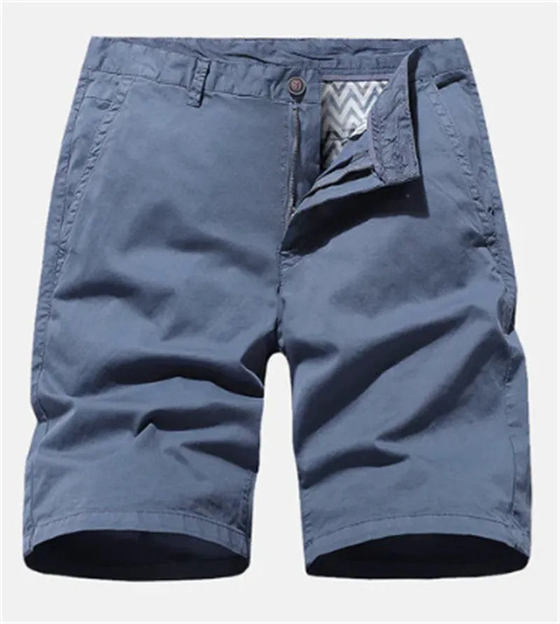 Man wearing blue printed denim casual shorts with a loose fit and straight leg, showcasing the no-belt workwear style.