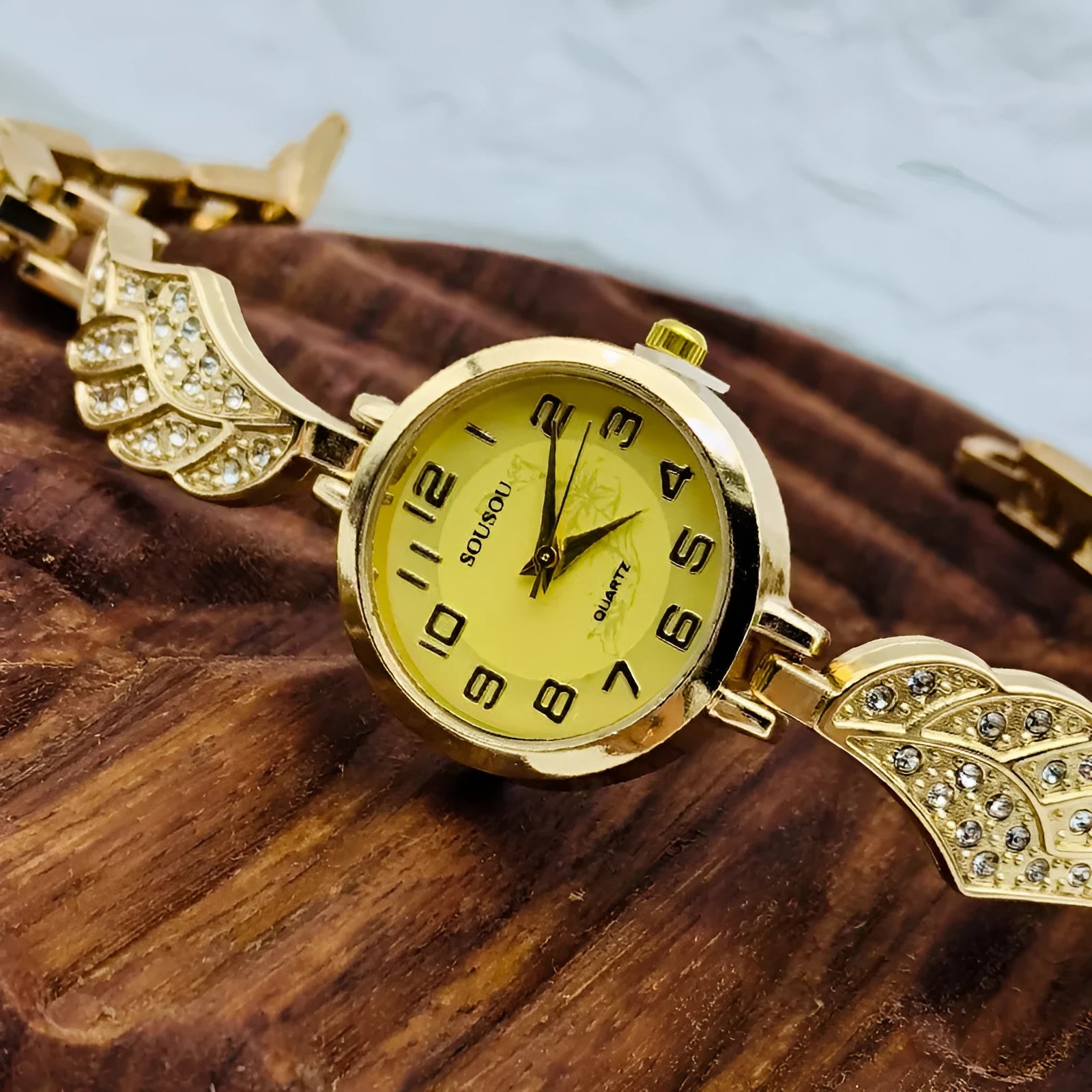Ladies stainless steel watch with round dial and 9mm thickness in gold, black gold, or white gold