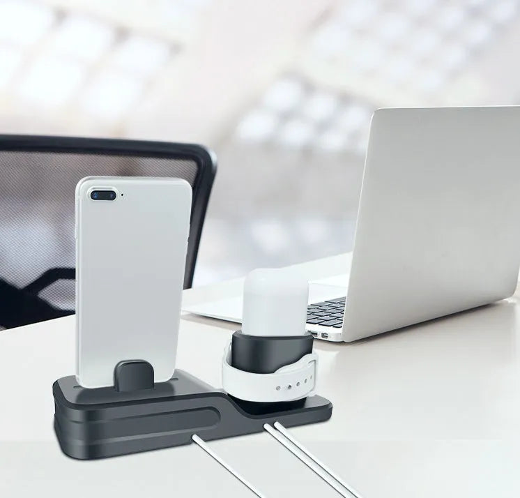 Black silicone 3-in-1 charging station for Apple iPhone, iWatch and AirPods on a desktop