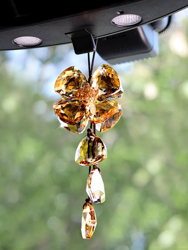 Crystal Four Leaf Grass car pendant hanging, showing its approximately 20cm size and transparent finish.