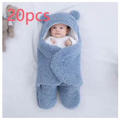 A baby quilted sleeping bag wrapper in a plain colour, showing its quilted pattern and soft cotton blend fabric.