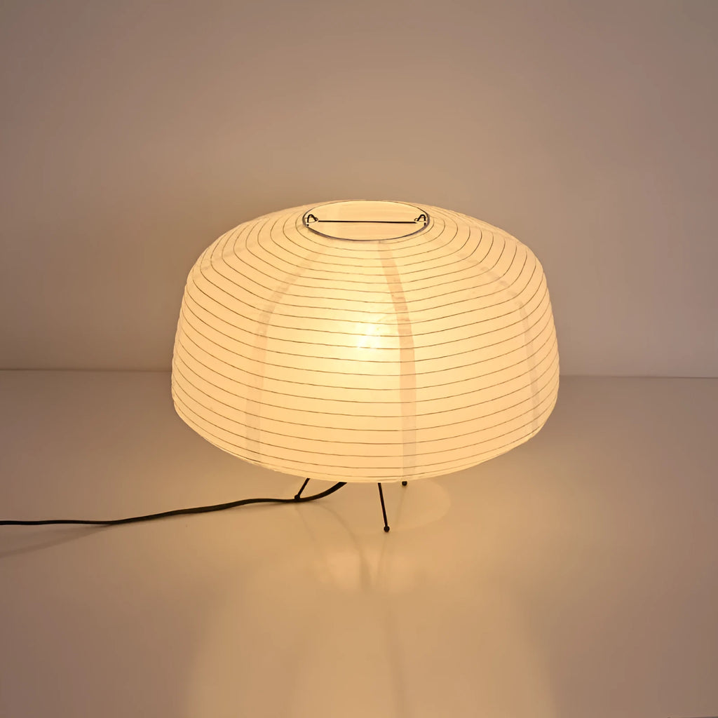 Japanese style xuan paper desk lamp on a wooden desk with soft warm light