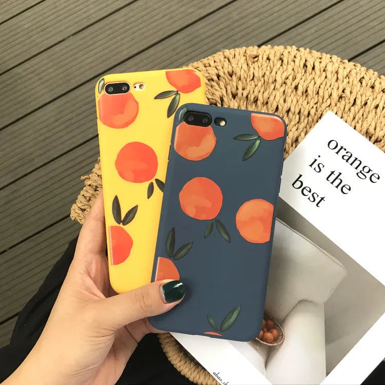 Orange matte finish TPU silicone case for iPhone on a table.