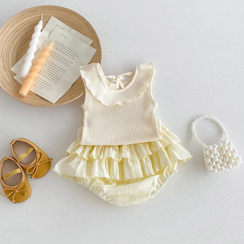 Beige cotton girls double layer bud-waisted shorts set with ruffled collar top on white background