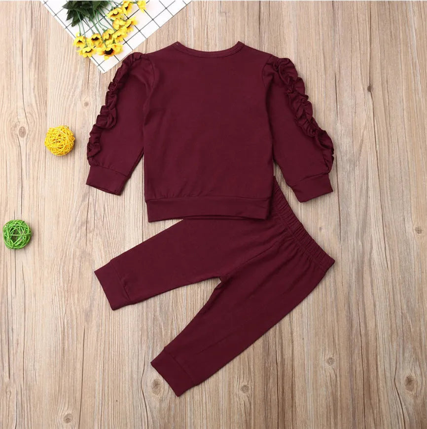 Baby two-piece outfit set with cotton long-sleeve ruffle sweatshirt and pants in solid colour, available in black, brown, wine red