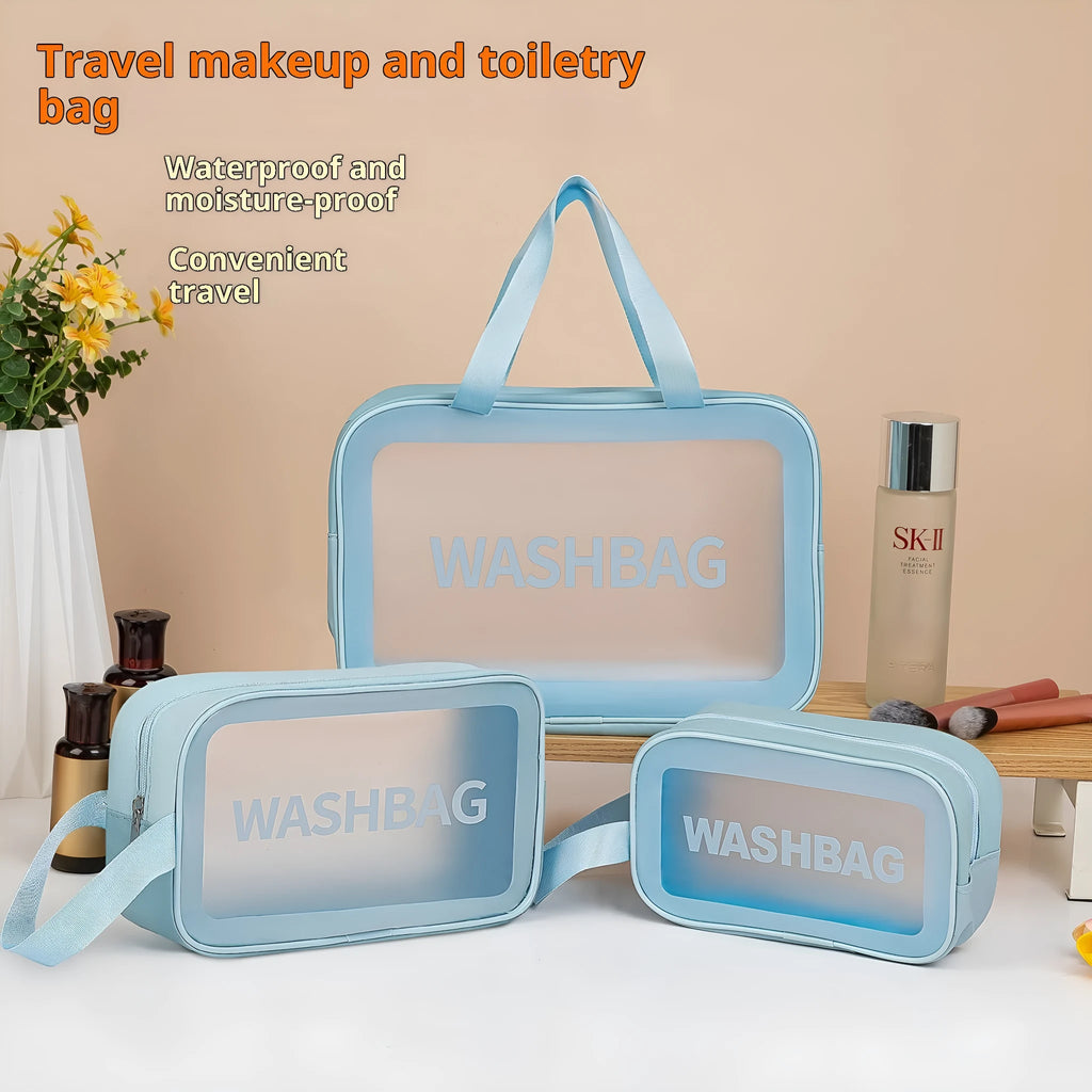 Large PVC transparent cosmetic bag three-piece set in various colours including beige, black, blue, pink, and white, empty and open on a flat surface