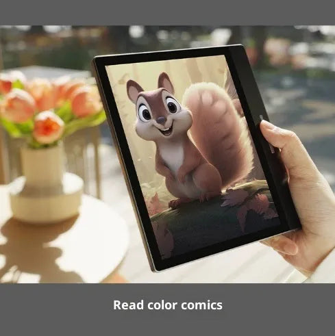7-inch black colour E-ink e-book reader with capacitive stylus on a desk showing a colour book page
