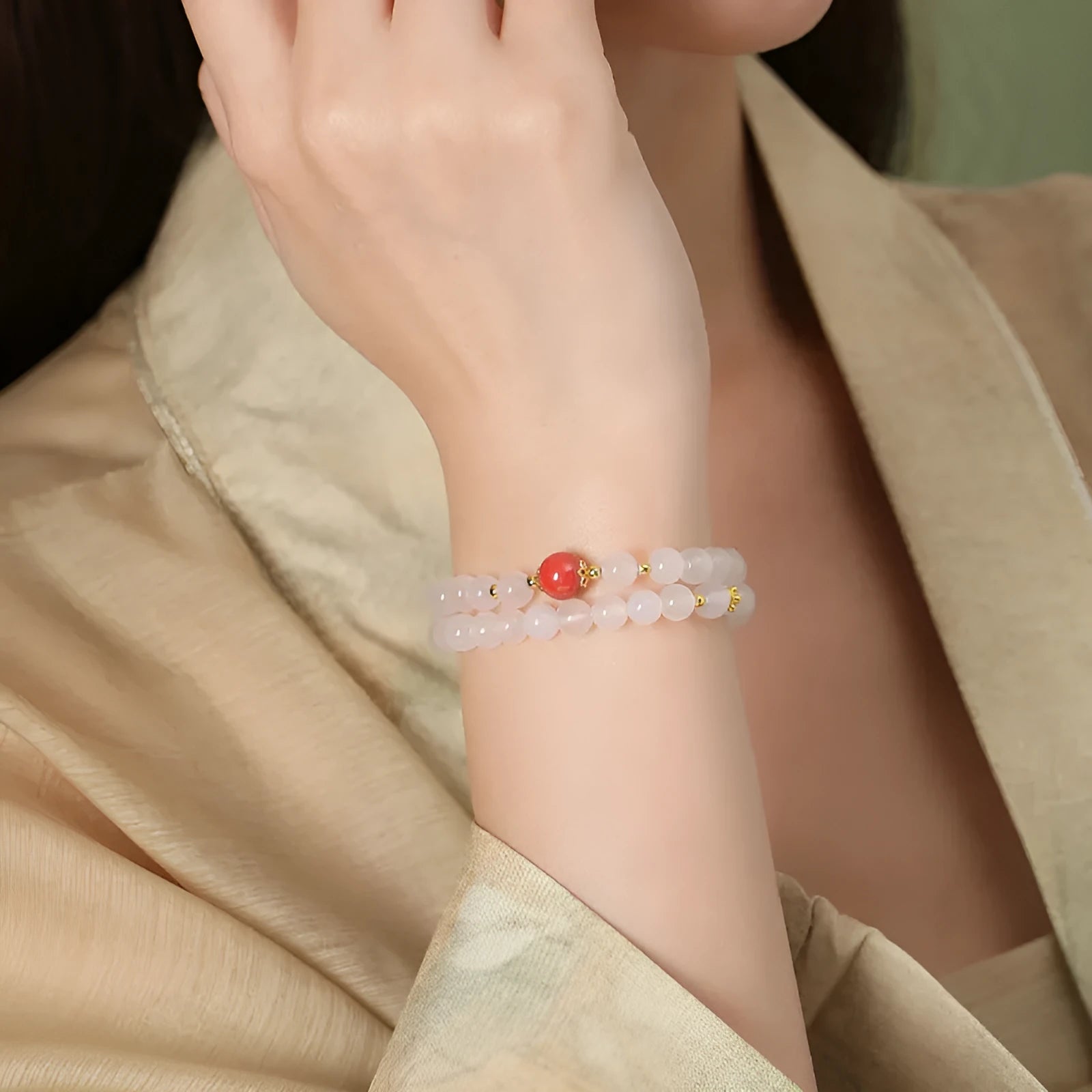 Women's white agate bracelet with cinnabar accents featuring 6mm geometry beads in double layer design