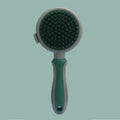 Double-sided pink cat brush with flea comb on reverse side and release button