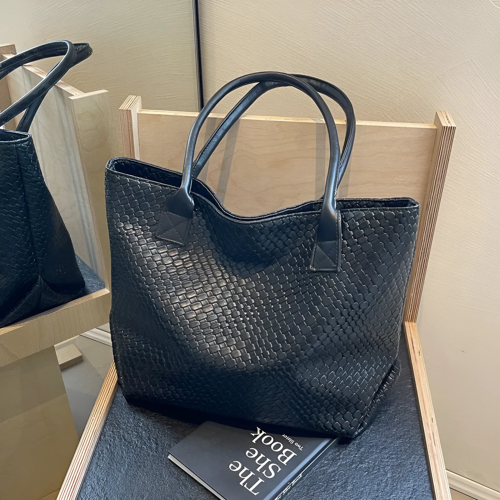 Woven PU shoulder bag for women with double straps, available in beige, black, gray, and khaki